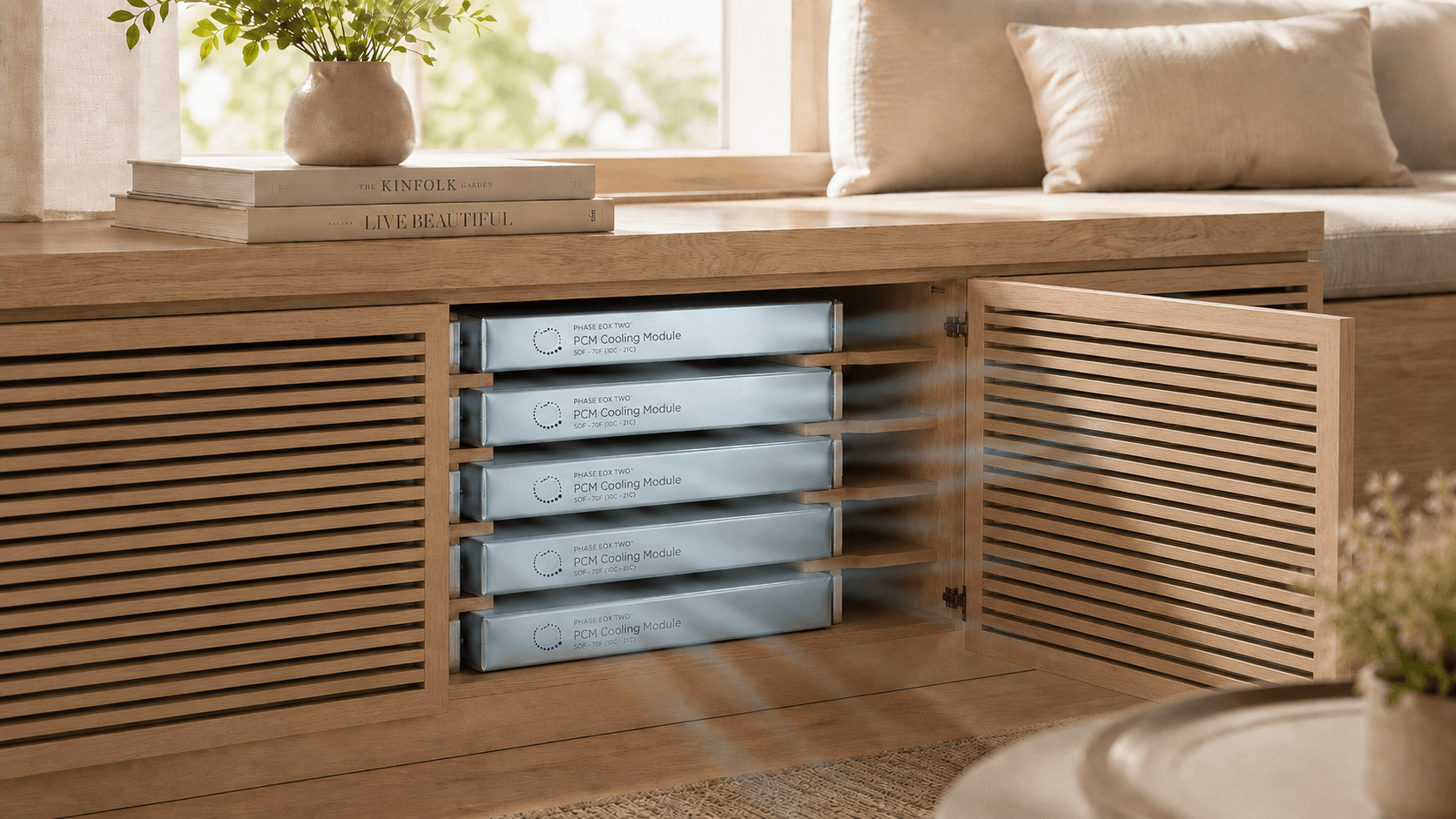 Window bench retrofit with a bank of PCM cooling cartridges revealed behind its slatted door